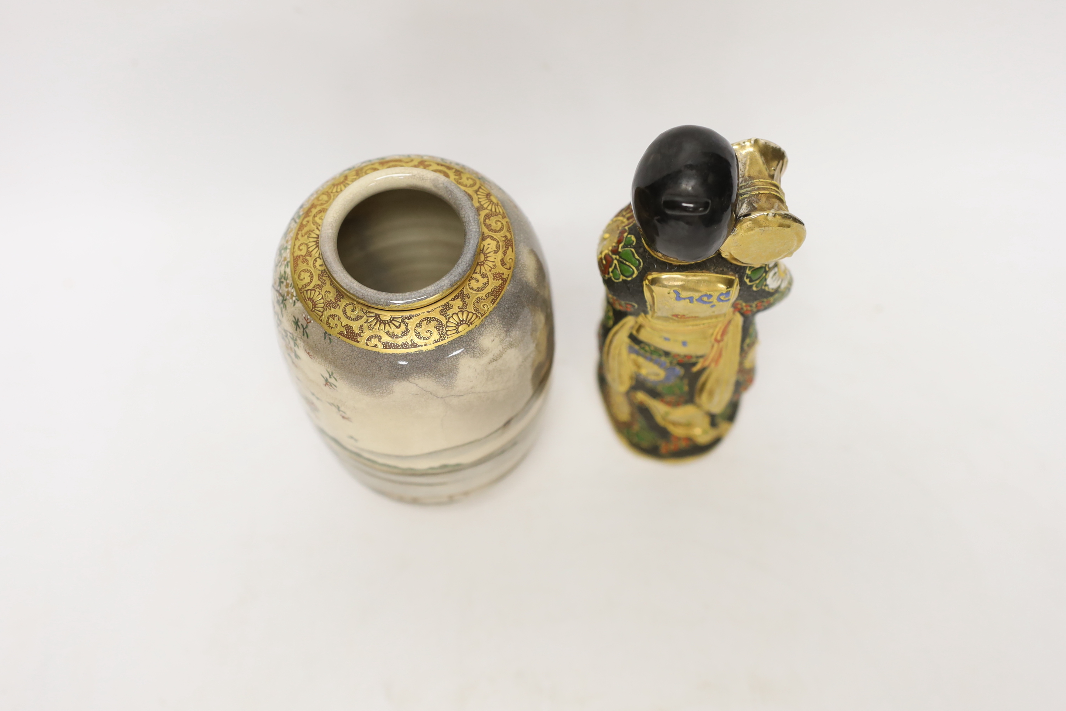 A Japanese Satsuma vase decorated with females wearing kimonos before a landscape and a figure